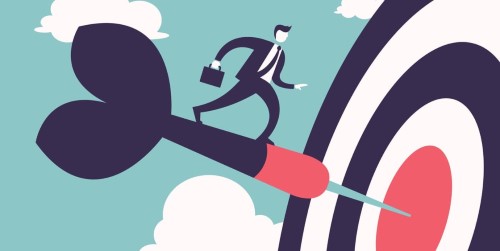 man walking on dart pinned to dartboard