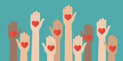 hands raised with hearts in the palms